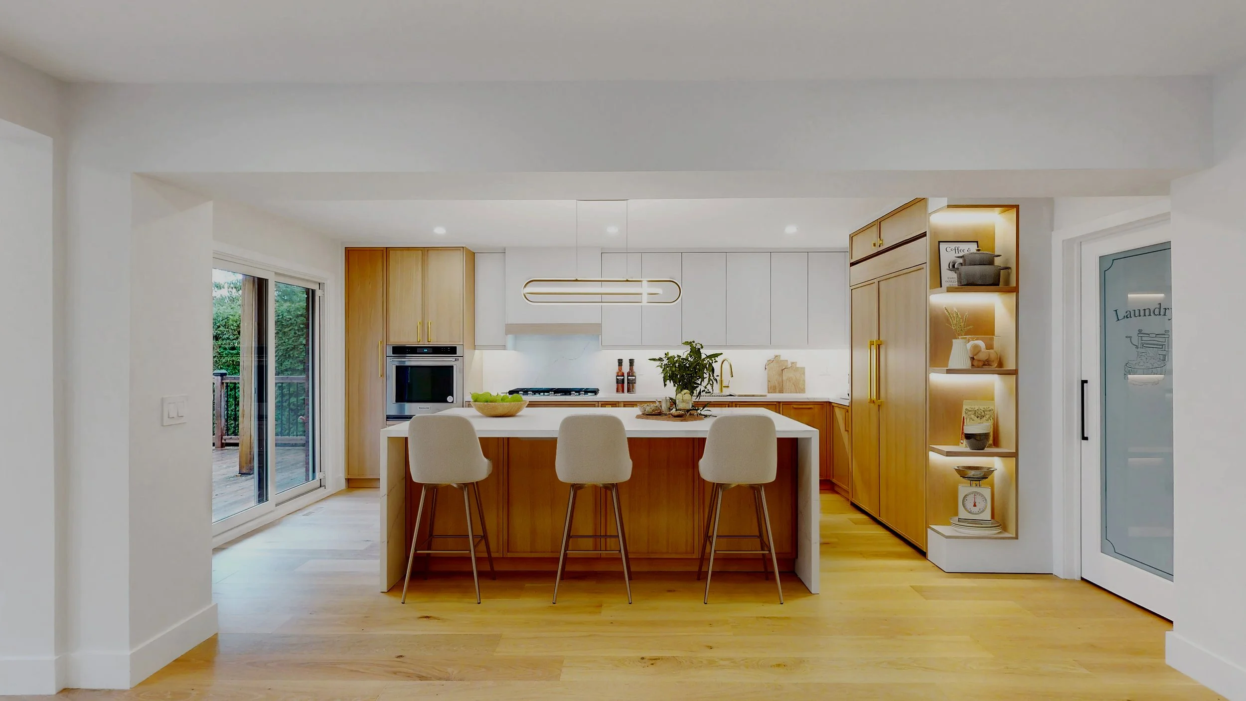 Renovated kitchen with custom cabinetry and stone countertops